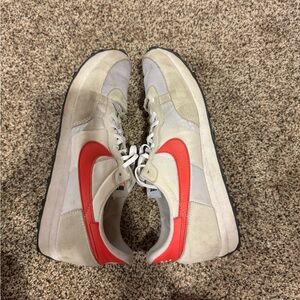 Nike Beige Sneakers with Red Accent